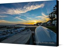 Canvas print of Sunset on the beach of Malaga, Spain by the artist Crossing Borders Media