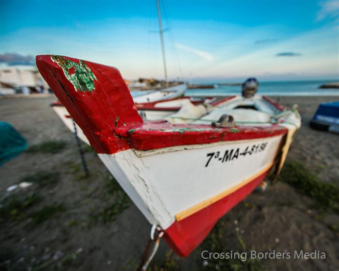 Boat-on-the-beach-of-Malaga--Spain by Crossing Borders Media