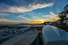 Poster print of Sunset on the beach of Malaga, Spain by the artist Crossing Borders Media